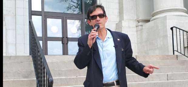 Candidate John Gentry speaking at a protest in front of the Hamilton County courthouse
